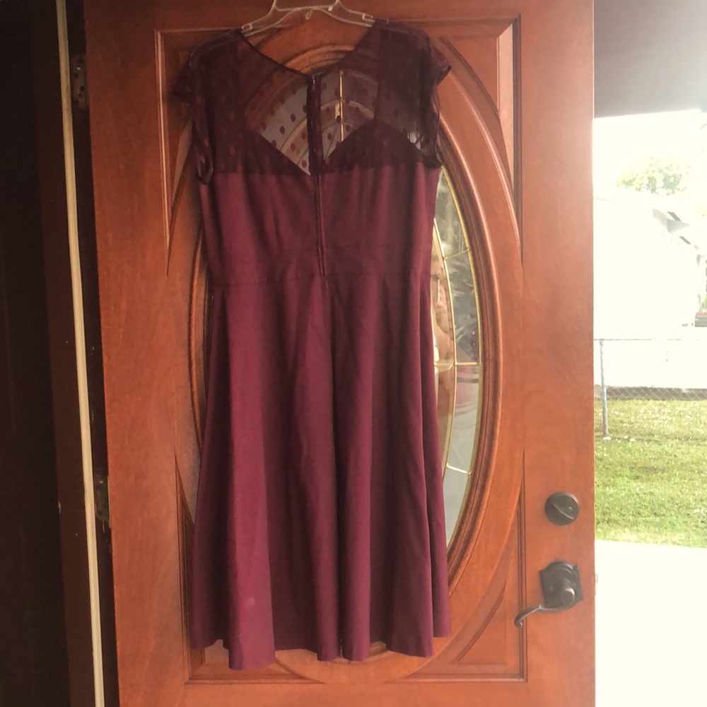 Festive dress. Deep red or burgundy.